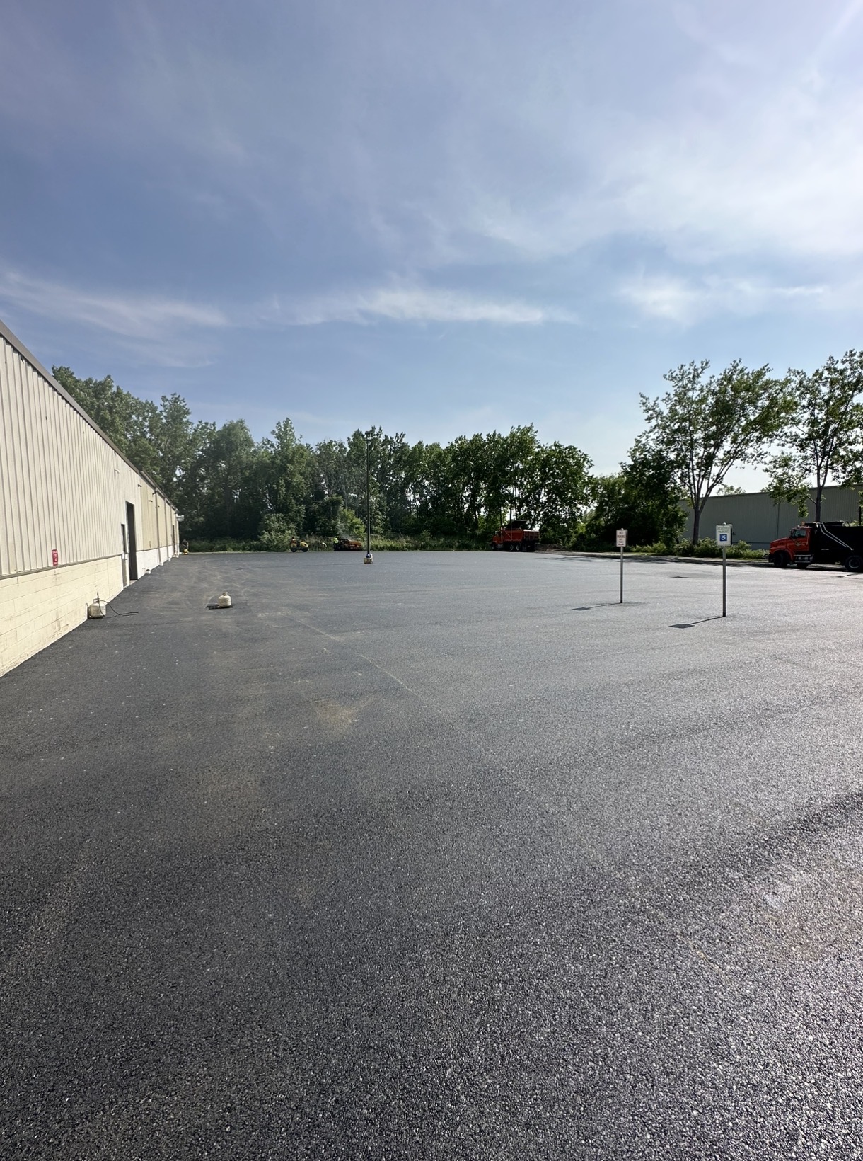 Large newly paved industrial parking lot