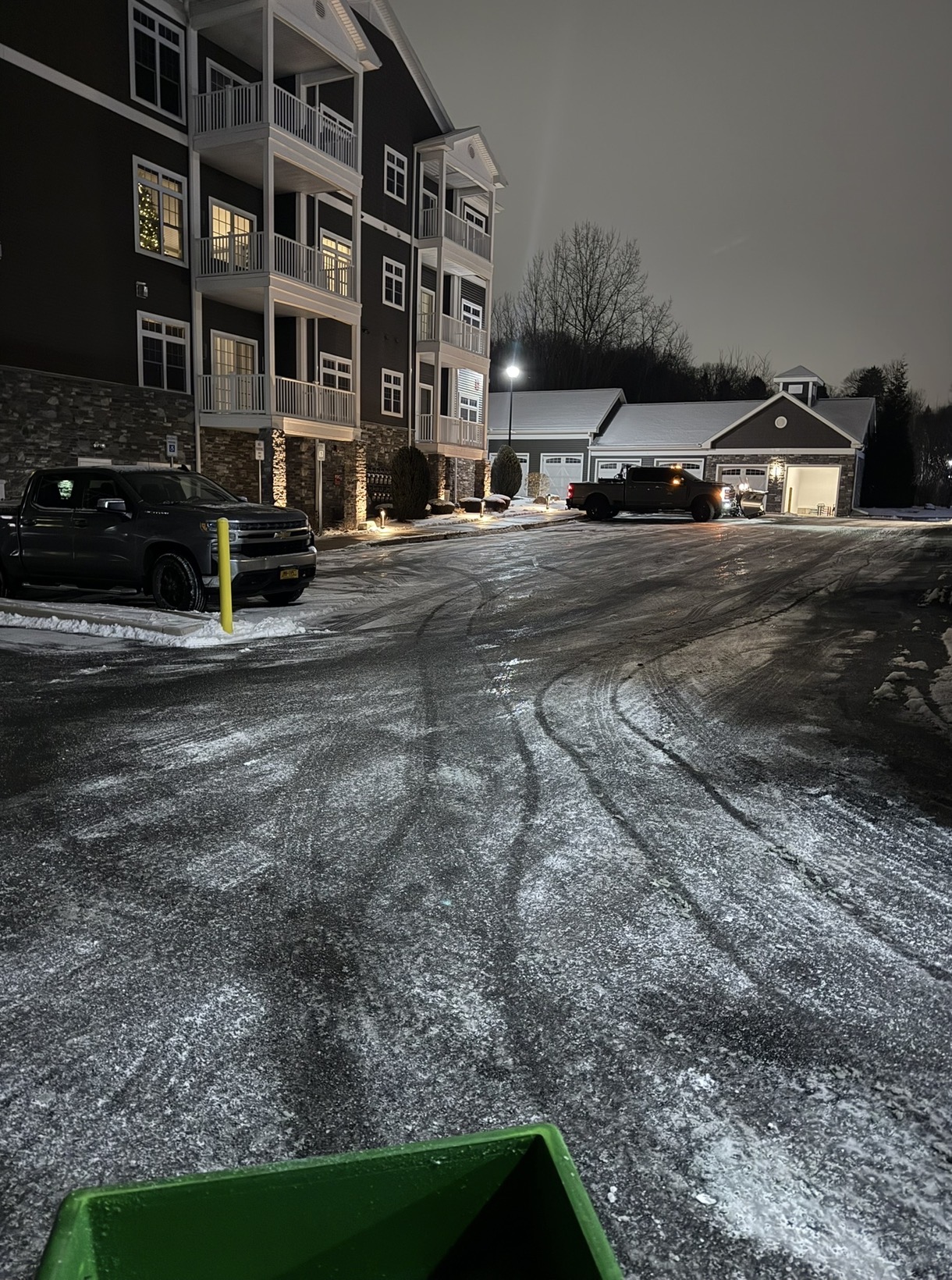 Nighttime plowing of an apartment complex parking lot