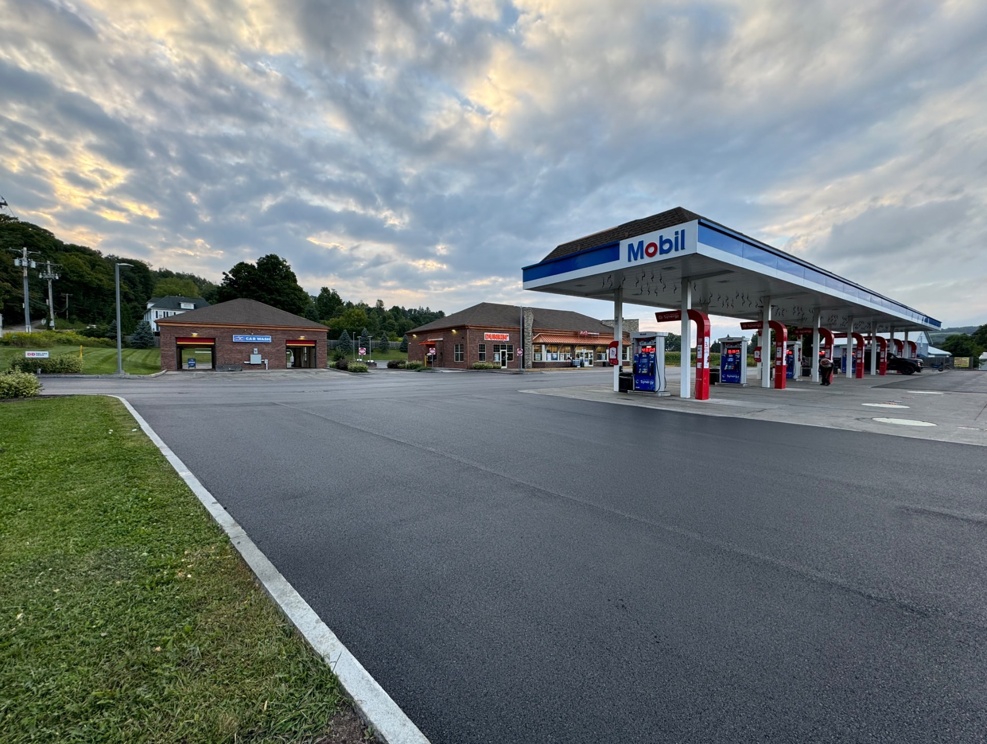 Completed asphalt paving at a gas station and car wash