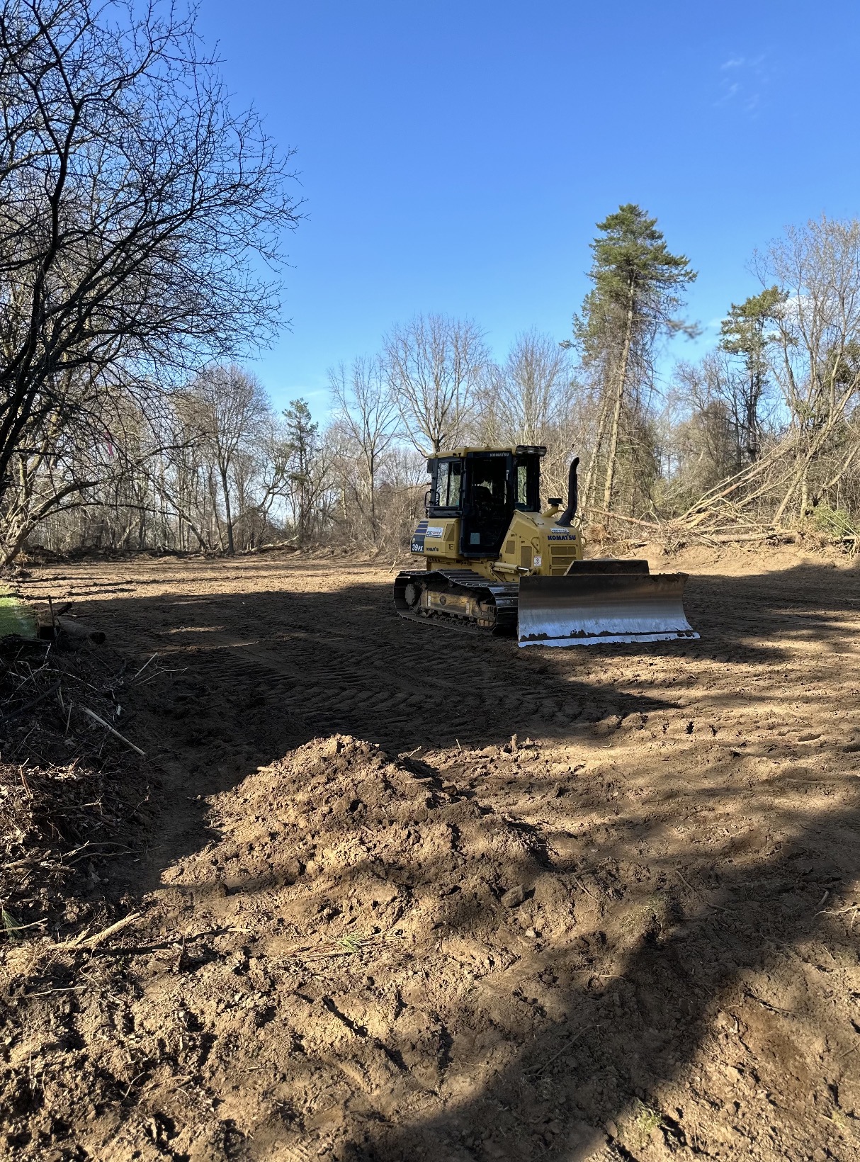 Dozer grading a freshly cleared building lot